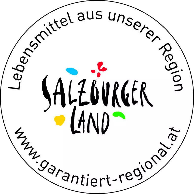 Rundes Zertifikat mit Schriftzug Salzburger Land und Text Lebensmittel aus unserer Region garantiert-regional.at